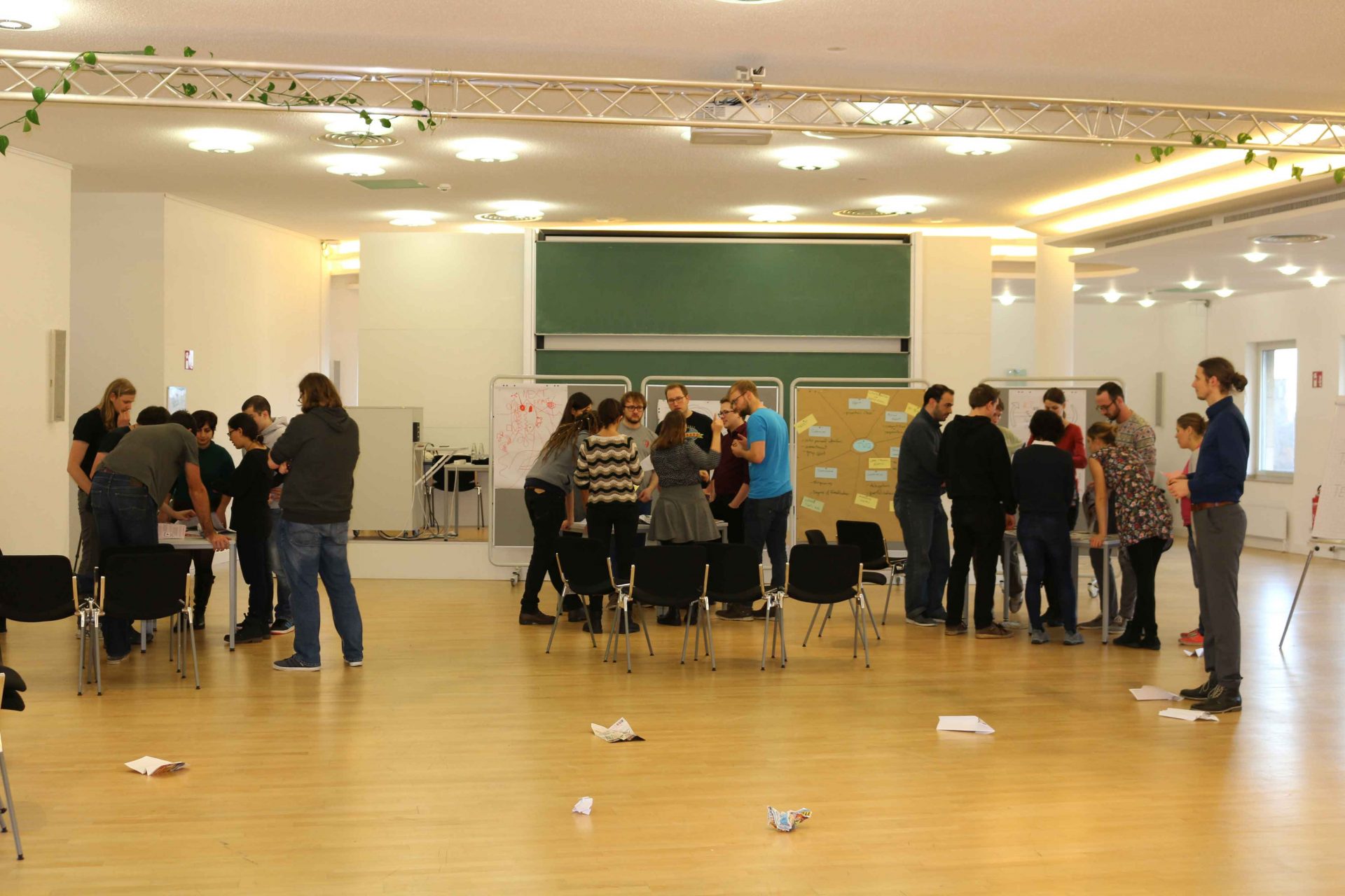 PhDs in a room with pin boards