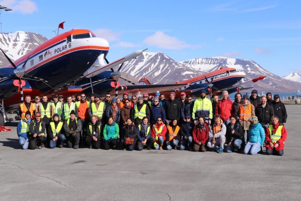 group photo on Spitzbergen in front of the tow polar aircraft