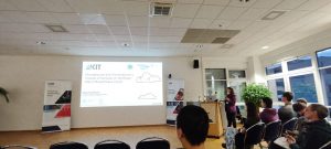 People in a conference room looking at a presentation